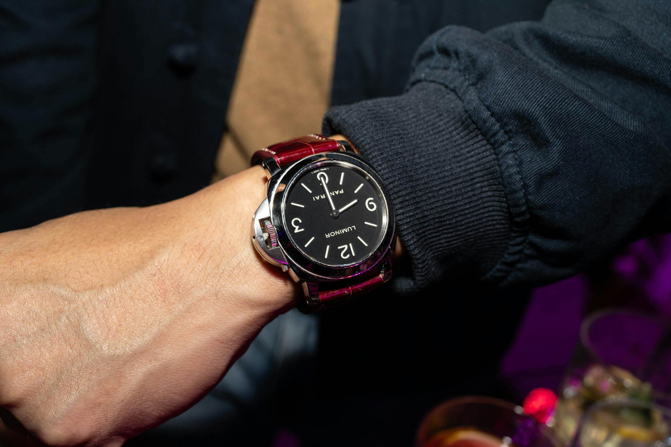 Panerai Luminor on wrist with red strap