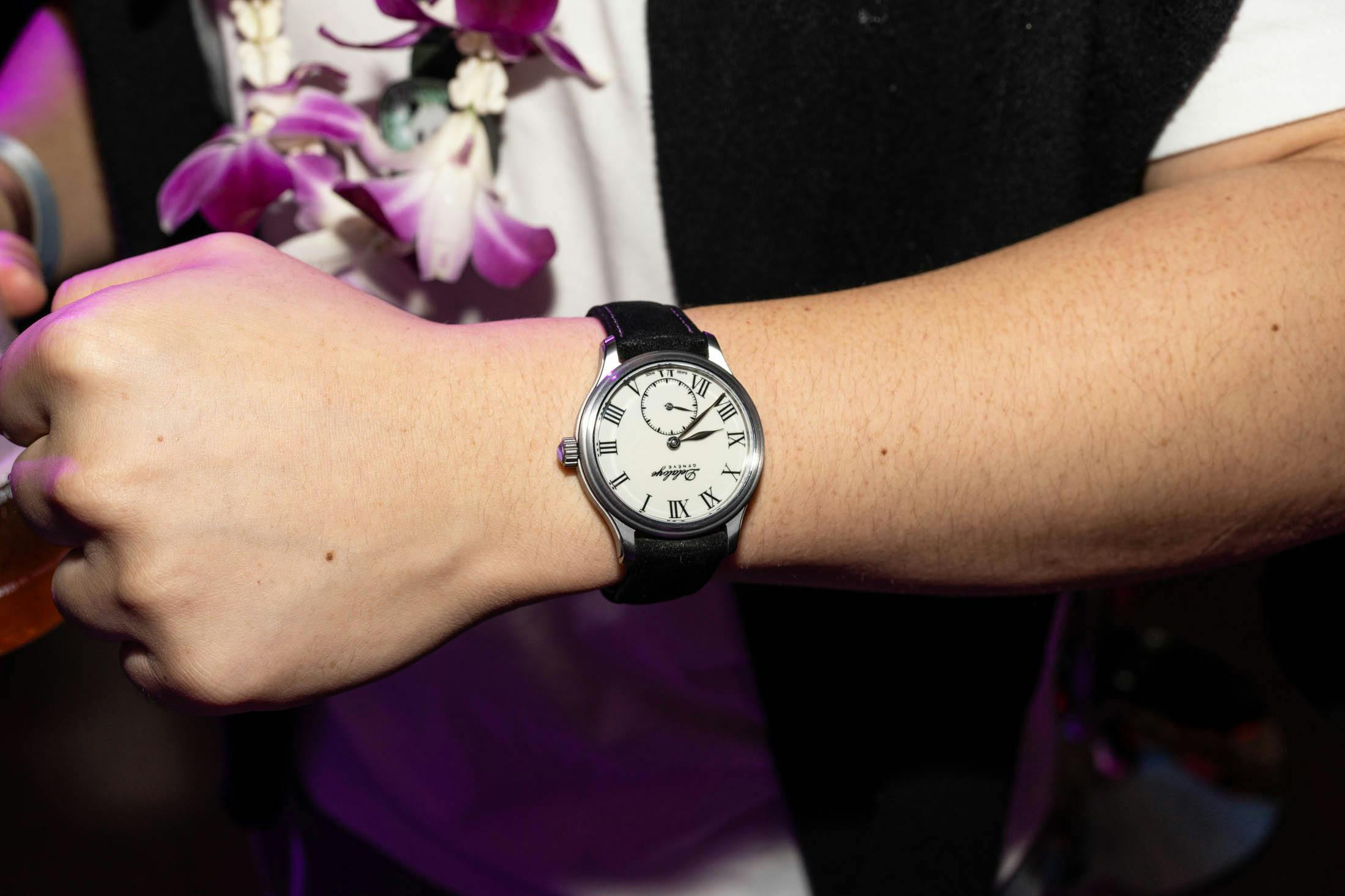 White dialed watch on wrist